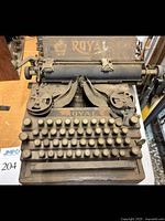 Top front view showing Royal logo, full keyboard, and general heavy dust condition