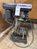 Full view of the Carrillo 5-speed drill press showing the motor, base, and drill table.