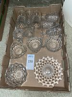 All 13 glass pieces arranged in box, showing various shapes and pattern details.