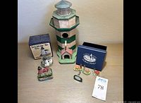 7-piece collection including lighthouse birdhouse, 4 miniature resin lighthouses, porcelain trinket box, and original packaging
