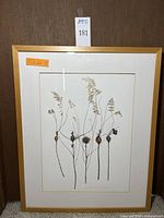 Full view of framed botanical artwork showing delicate goldenrod stems and seed pods with artist signature and measurement