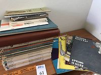 Overall view of stacked magazines and typography manuals