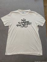 Front view of white men's T-shirt with black text graphic 'Not Looking For Advice!'