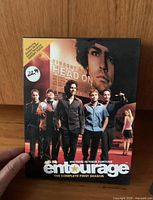 Front cover of the Entourage The Complete First Season DVD set showing main cast and a price sticker of $22.99.