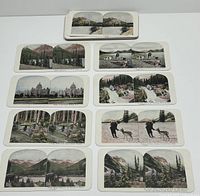Photo showing 9 of the coloured Canadian stereoview cards laid out. Scenes include natural landscapes, waterfalls, wildlife, urban buildings.