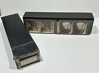 Photo showing the collection box labeled 'Stereoviews of England' with cards partially inside a black box.