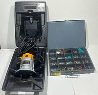 Black & Decker router inside molded plastic case with open metal case next to it showing assorted router bits