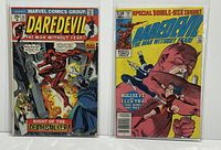 Front view of two Daredevil comic issues #115 and #181, bagged and boarded