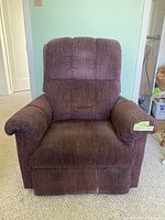 Front-facing image of the burgundy La-Z-Boy reclining chair showing full chair with padded armrests and textured fabric upholstery.