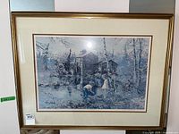 Framed art print showing rustic watermill scene with children, signed by artist in bottom margin.