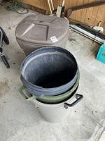 Photo showing the stacked bins inside the brown Rubbermaid garbage can with lid next to it.