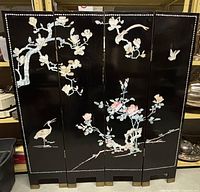 Front view of the entire four-panel black lacquered room divider with mother of pearl inlays and hand-painted birds and flowers, showing overall design and condition.