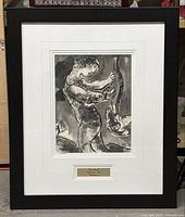 Full view of framed black and white print by Marc Chagall depicting a woman holding a bow and a flying angel figure.
