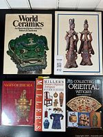 Top view showing all five books with titles visible including World Ceramics, Vases of the Sea, Miller's Chinese & Japanese Antiques Buyers Guide, and Collecting Oriental Antiques.