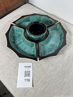 Set assembled showing three chip trays surrounding central dip bowl with blue glaze and dark edges.