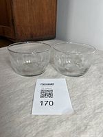 Pair of clear vintage Libbey glass cereal bowls with pine cone garland motif displaying size and condition