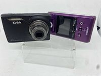 Front view of Kodak camera and Sony Bloggie camcorder