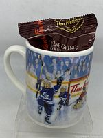 Mug front view with sealed coffee packet inside
