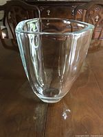 Front and side views of clear crystal triangular vase with thick walls
