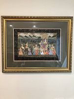 Framed Indian Mogul processional painting showing Maharaja on palanquin with attendants and animals in scenic landscape.