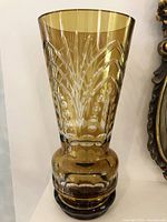 Full view of the vintage yellow crystal vase against a neutral background, showing detailed cut crystal patterns and rounded base.