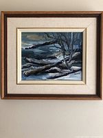 Framed oil painting showing the winter landscape with bare trees and fallen branches, titled "Spring Thaw" by Nell Lamarsh.