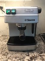 Front view of Saeco Via Veneto espresso and cappuccino machine on countertop showing brand and model name.