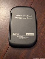 Closed view of the front cover of the calculator showing branding from Pension Investment Management School, William Mercer, Russell, and York University Schulich School of Business.