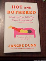 Front cover of the book showing the title, author, and illustration of a woman on a couch.