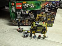 LEGO Ninja Turtles 79115 Turtle Van set including the assembled van, barrier, and minifigures with original box