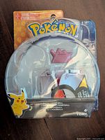 Front view of sealed Pokemon Tomy Ditto figure package showing the purple Ditto figure and a Pokeball accessory.