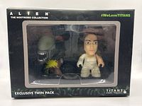Front view of the Alien The Nostromo Collection exclusive twin pack vinyl figure set in original packaging showing Ripley figure and Xenomorph figure inside clear window.