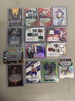 Top view of autographed football sports cards including rookies with memorabilia patches and signatures