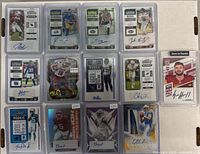 Full overview of 14 autographed football cards featuring various rookies and players in plastic holders.