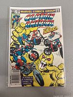 Front cover of Captain America #269 showing Team America and Captain America on motorcycles with a large robotic yellow hand.