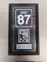 Full view of the framed Sidney Crosby hockey piece with jersey number 87, hockey card, and plaque.