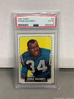 Front of 1964 Topps Cookie Gilchrist Buffalo Bills football card with PSA grading label showing grade VG-EX 4 and serial number.