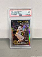 Front view of the graded 2024 Topps Chrome Jackson Merrill Prism Refractor rookie card in protective PSA slab showing player image, team, and condition rating Mint 9.