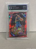 Front of Chet Holmgren rookie card graded 9.5 by Arena showing red sparkle pattern and holographic effect.
