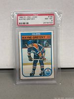 Front of PSA slab showing 1982 O-Pee-Chee Wayne Gretzky card graded NM-MT 8 by PSA