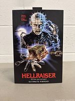 Box front showing artwork of Pinhead character and Hellraiser branding.