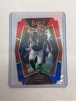 Front of Ja'Marr Chase 2021 Panini Select Prizm die-cut rookie football card showing player in Cincinnati Bengals uniform with rookie logo.