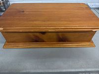 Closed wooden chest on tabletop