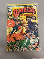 Front cover of the 1976 Marvel Comics Group Omega The Unknown comic book, issue #1, showing the featured superhero Omega fighting enemies.