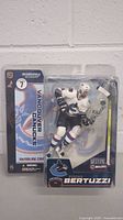 Front of original packaging showing Todd Bertuzzi figure in Vancouver Canucks uniform in clear blister pack with backing card