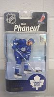 Front view of McFarlane NHL Dion Phaneuf Toronto Maple Leafs action figure in sealed packaging.