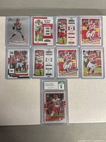 Photo showing all 10 Patrick Mahomes cards including the slab graded 2020 Donruss Optic card.