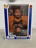 Front view of the package showing Funko Pop figure and Slam magazine cover of Jalen Brunson in Knicks uniform.