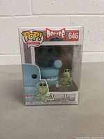 Front view of boxed Funko Pop! Chairry & Pterri figures from Pee-Wee Herman TV show, showing labels and characters inside.