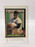 Front view of the 1983 Donruss Roger Clemens rookie card showing player in pitching position with team logo and card number 273.